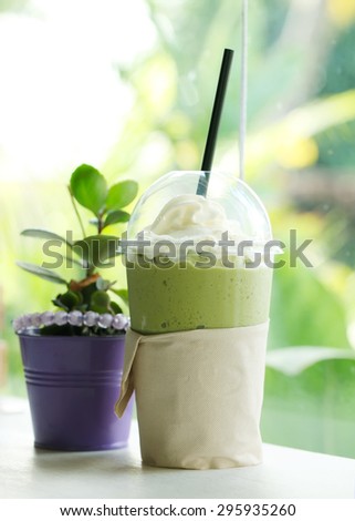 Green tea smoothie whipped cream on nature backgrounds.