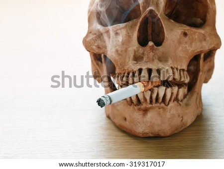 Human skull smoking a cigarette,No smoking campaign,Smoking is fatal.