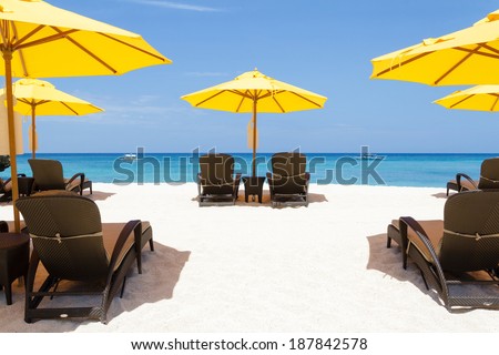 Yellow sun umbrellas and beach chairs,boracay,Philippines