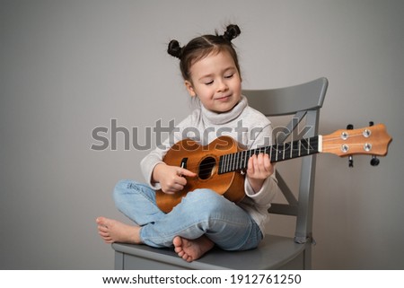 Similar – Image, Stock Photo Child playing guitar