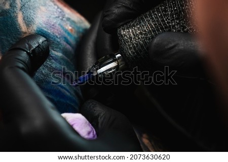 Similar – Image, Stock Photo Master doing tattoo on forearm of male customer