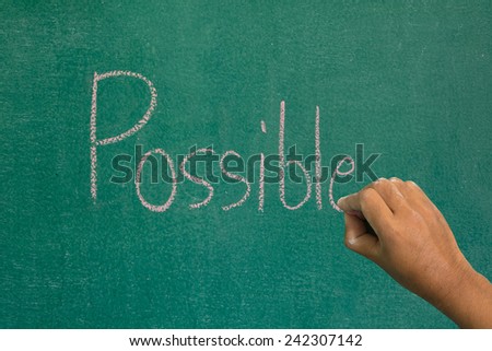 Hand pointing at possible word of success concept on chalkboard