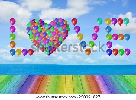 sky with wooden paving.Multi-colored balloons as well as the word love.