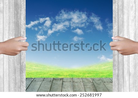 Two hands to open the door Natural background