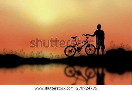 Children and bike silhouette on the surface. Sunset background