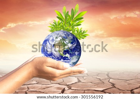 We love the world of ideas.world and trees in human hands.Cracked earth background. Elements of this image furnished by NASA.