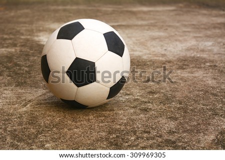 Soccer ball on the cement floor