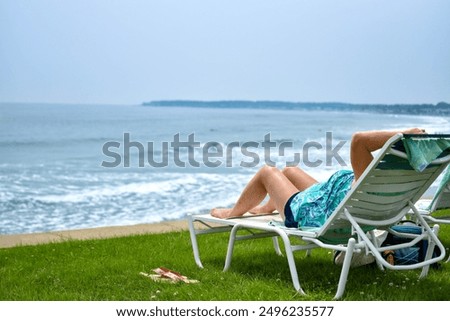 Similar – Image, Stock Photo Anonymous woman sunbathing on rocky beach