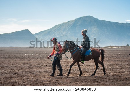 MOUNT BROMO , JAVA INDONESIA - 15 MAR 2014  :  Horse riding service around Bromo walking from crater to the parking areas.