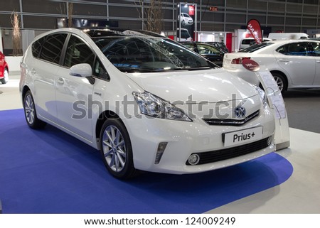 VALENCIA, SPAIN - DECEMBER 7 - A White 2012 Toyota Prius Hybrid Vehicle at the Valencia Car Show on December 7, 2012 in Valencia, Spain.
