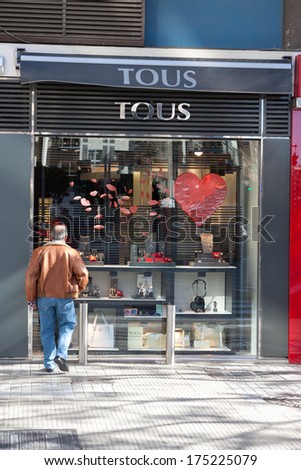 VALENCIA, SPAIN - FEBRUARY 6, 2014: A Tous retail store on a street in Valencia. Tous is a Spanish jewelry, accessories and fashion firm based in Catalonia, Spain with over 400 stores in 45 countries.