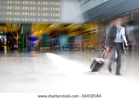 Business man walking in the Airport Terminal
