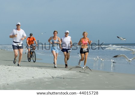 ATLANTIC BEACH, FLORIDA - FEBRUARY 28: Runners compete in the Jetty to Jetty Ultra marathon and Team Relay on February 28, 2009 in Atlantic Beach, Florida.