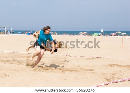 VALENCIA, SPAIN - JULY 3: Girls Rugby teams participate in the City of Valencia XIV International Beach Rugby Competition on July 3, 2010 in Valencia, Spain.