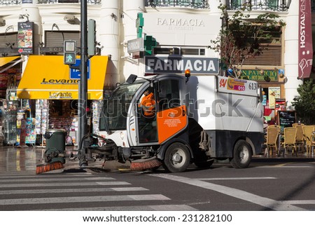 VALENCIA, SPAIN - NOVEMBER 16, 2014: A mechanical street sweeper in downtown Valencia. The very first street sweeping machine was patented in 1849 by its inventor, C.S. Bishop.