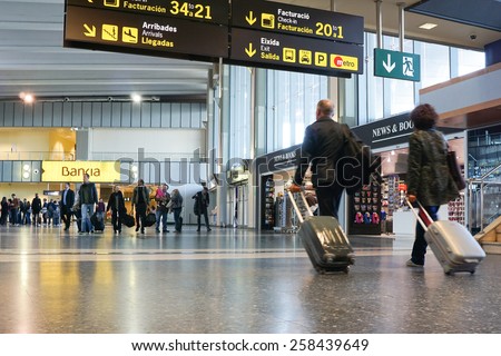 VALENCIA, SPAIN - NOVEMBER 17, 2014: Airline passengers inside the Valencia Airport. About 4.98 million passengers passed through the airport in 2013.
