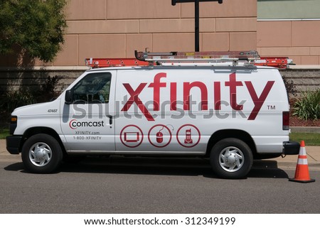 BATTLE CREEK, MICHIGAN - AUGUST 21, 2015: A Comcast Cable/Xfinity service van park on the street. Comcast is the largest home internet service provider in the United States.