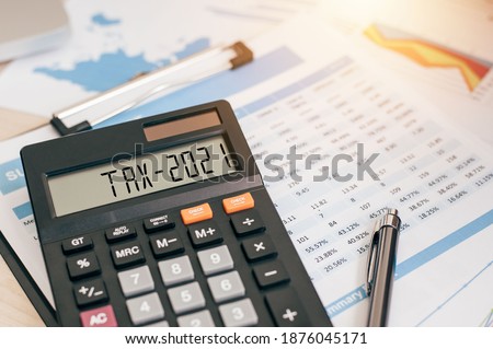 Tax word and 2021 number on a calculator. Business and tax concept. Pay tax in 2021 years. The new year 2021 tax concept