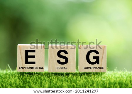 words ESG on a wood block and Future environmental conservation and sustainable ESG modernization development by using the technology of renewable resources to reduce pollution and carbon emission.