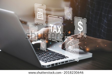 Busines using a computer to complete Individual income tax return form online for tax payment. Government, state taxes. Data analysis, paperwork, financial research, report. Calculation tax return.