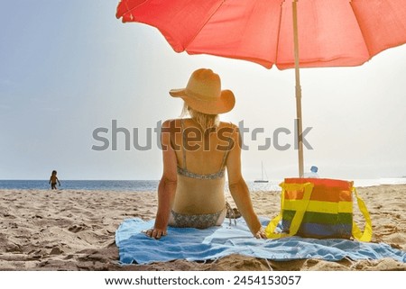 Similar – Image, Stock Photo Anonymous woman sunbathing on rocky beach