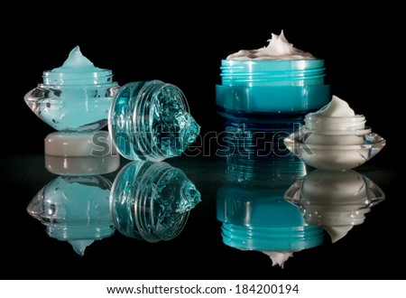 Cosmetics - Cream and gel in various cosmetic containers, jars