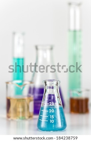 Lab equipment, glassware kit filled with various colored liquids and gels