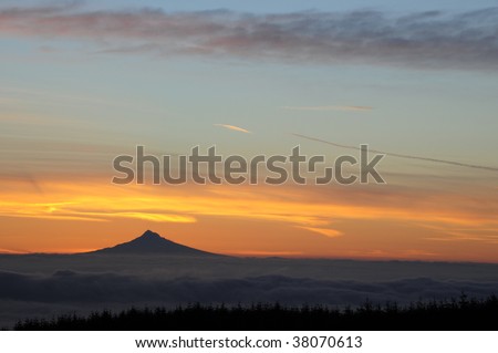 Colorful sunrise behind Mount Hood, Oregon in mid-winter.