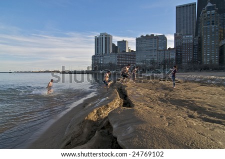 CHICAGO, IL - FEBRUARY 10: Several People take advantage of the record temperatures and go for a swim on February 10, 2009 at Oak Street Beach in Chicago, IL
