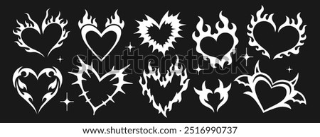 Neo tribal aesthetic y2k tattoo with heart shape. White gothic romance stickers or cyber ornament set. Neotribal emo love logo. Trendy hand drawn goth stylized burning hearts silhouette on fire flames