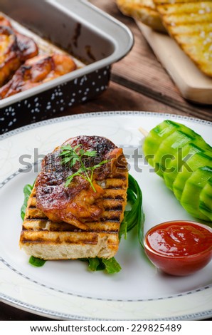 Sticky chicken with spicy sauce, toasted panini with coarse-grained salt and olive oil plus cucumber kebab