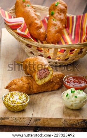 Corn dog with three sauces, chilli, mayonnaise with herbs and whole grained mustard