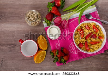 Healthy breakfast cornflakes with milk and strawberries, bio healthy, eat clean