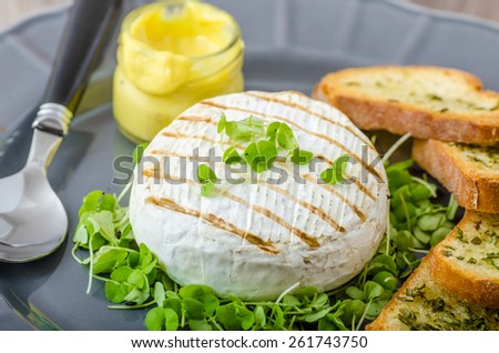 Grilled camembert with fresh herbs, herb crispy baguettes, Dijon mustard