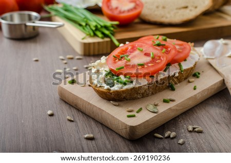 Healthy breakfast - homemade beer bread with cheese, tomatoes and chives
