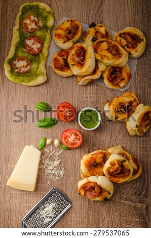 Variantion of pizza - with herbs pesto and tomatoes, calsone pizza and pizza rolls
