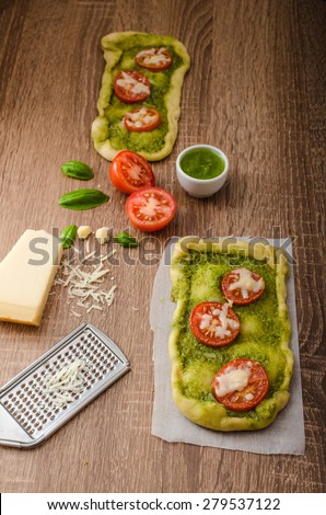 Variantion of pizza - with herbs pesto and tomatoes, calsone pizza and pizza rolls