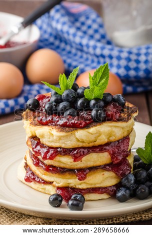 Glutten-free pancakes with jam and blueberries, bio healthy ingredients, fresh mint on top