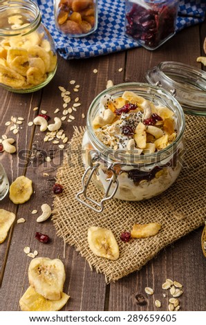 Homemade yogurt with granola, dried fruit and nuts bio - cia seed - most healthy seed, apricot and banana dried fruit