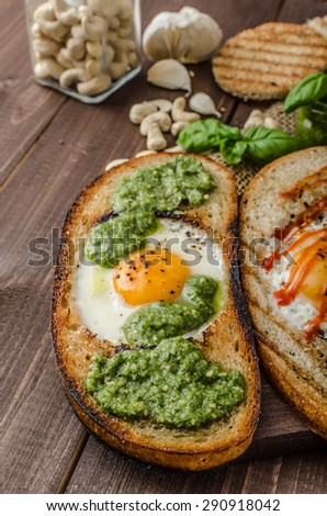 Vatiations of fried eggs inside bread, panini bread with pesto and hot sriracha sauce