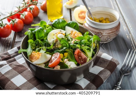 Similar – Image, Stock Photo Spinach salad with eggs avocados tomatoes and mozzarella cheese