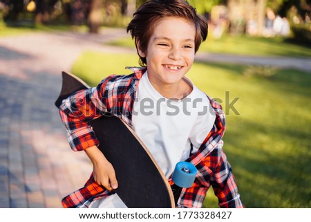 Similar – Foto Bild Kind mit Skateboard und Sonnenbrille macht Rocksymbol mit erhobenen Händen