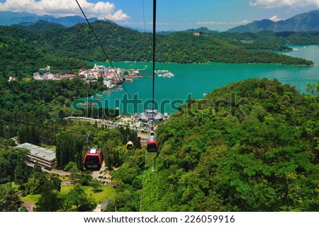 Nantou, Taiwan - June 19, 2011 : The ropeway above the Sun-Moon-Lake, people can view whole the Sun-Moon-Lake in the cable car.