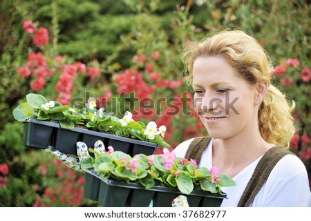 Woman with container-grown plants