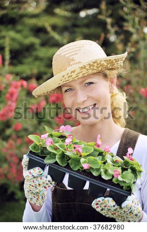 Woman with container-grown plants