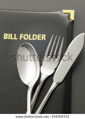 cutlery set on the bill folder