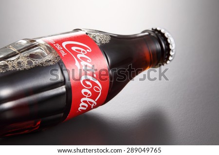KUALA LUMPUR, MALAYSIA - June 6TH, 2015. A bottle of Coca Cola soft drinks. Coca Cola drinks are produced and manufactured by The Coca-Cola Company, an American multinational beverage corporation