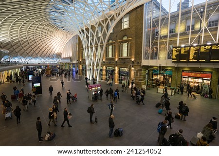 LONDON, UK - DECEMBER 31: People in the departure concourse of King\'s Cross Station. LONDON on DECEMBER 31, 2014.