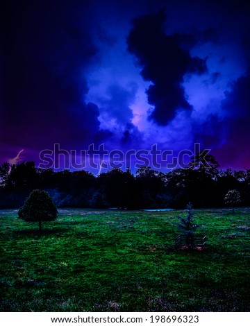 Thunder and lightning storm over Berkshire field at night