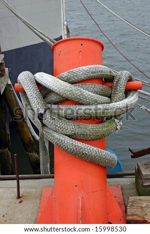A boat line tied securely to a dock